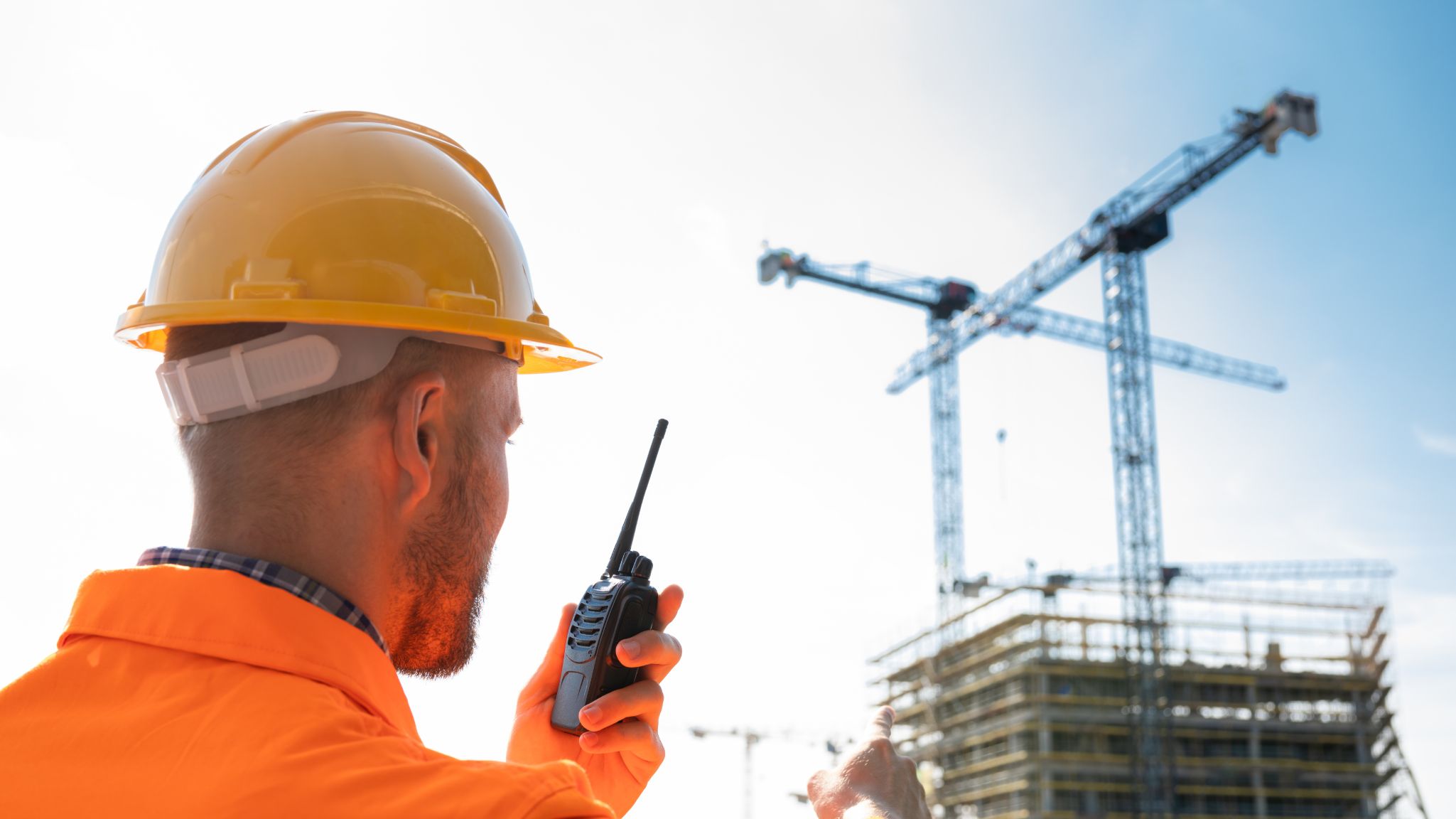 construction worker with a walkie talkie